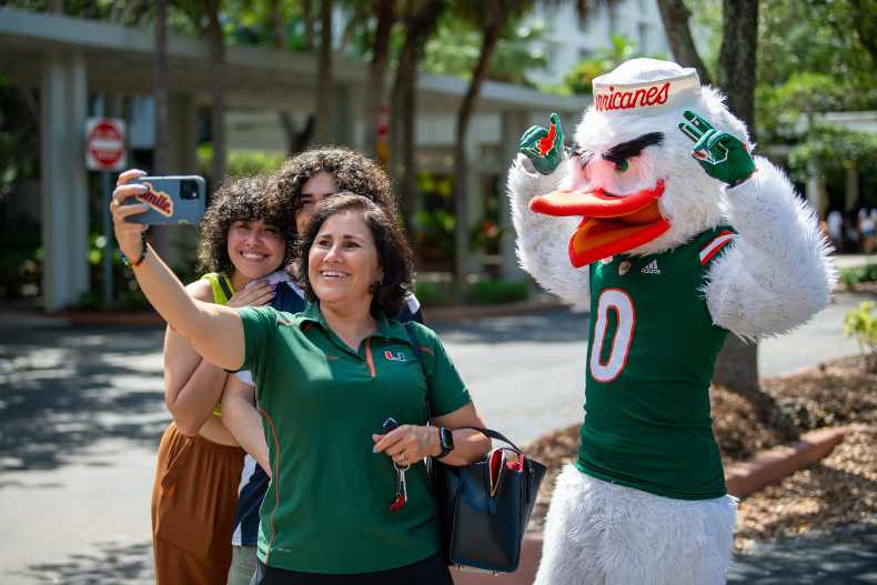 Professor Carmen Presti takes a selfie with her son, Noah, daughter Rebecca Bulnes, and Sebastian the Ibis during move-in day for the 2023 Summer Scholars Pre-College Program. Photo by Armando Rodriguez