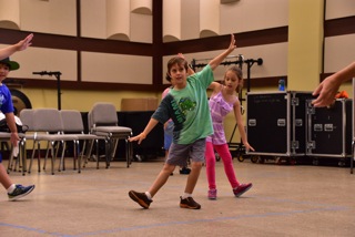 Young Musicians stretching before a group activity