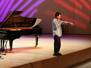 Jacob Collier addresses the crowd at the Frost School of Music