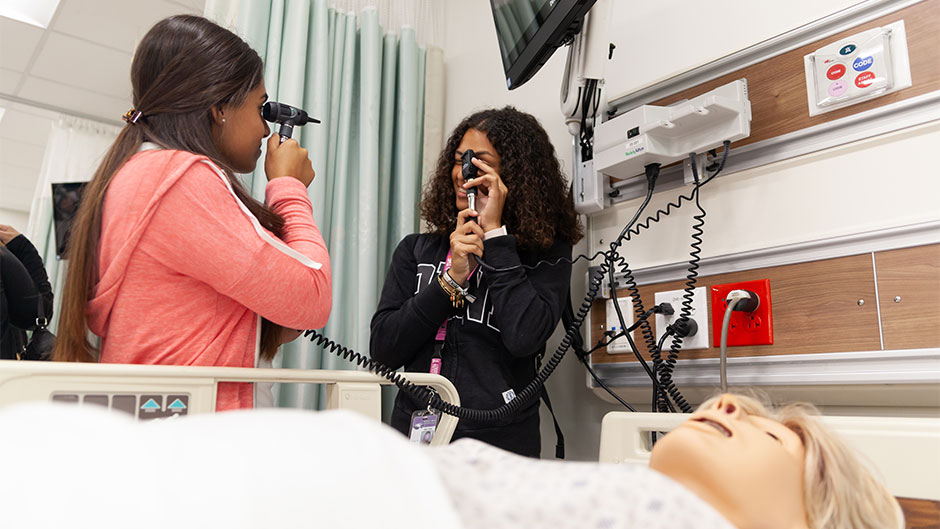 Students from Southwest High School explore the simulation hospital at the UM School of Nursing and Health Studies as part of Big Brothers Big Sisters' School to Work program.