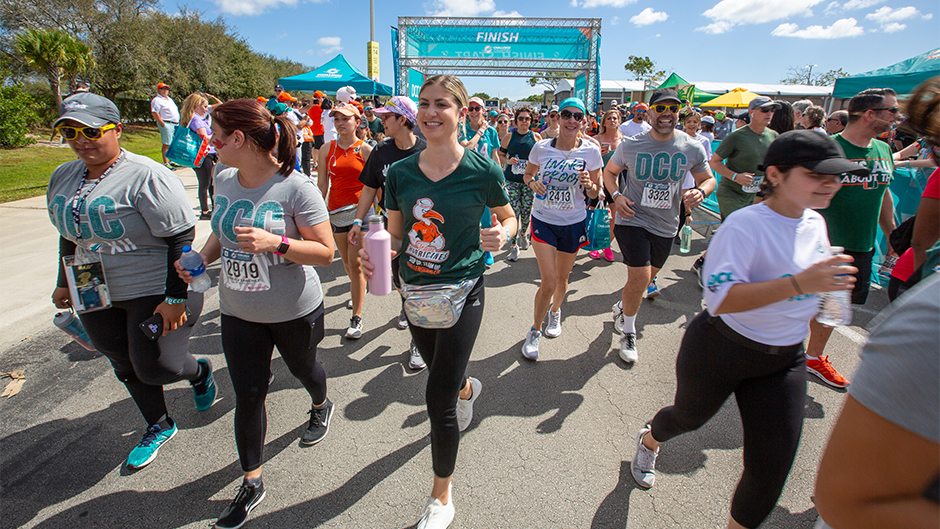 Participants walk together during the Dolphins Challenge Cancer XII 5k event.