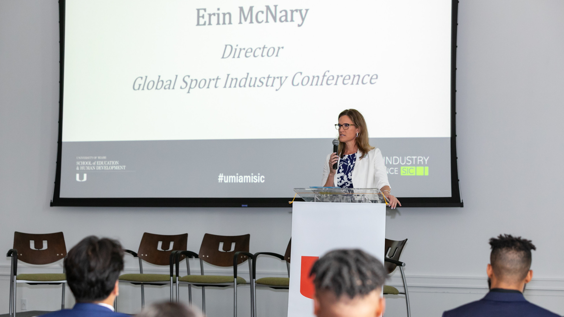 Conference Director Erin McNary addresses the crowd of attendees at the Global Sport Industry Conference in the Donna E. Shalala Student Center on campus.