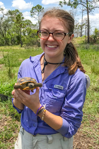 Leyna Stemle with a juvenile gopher tortoise