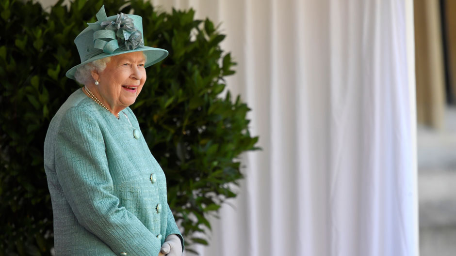 Britain's Queen Elizabeth II looks out during a ceremony to mark her official birthday at Windsor Castle in Windsor, England, Saturday June 13, 2020. Queen Elizabeth II’s birthday is being marked with a special ceremony taking care for social distancing by everyone present amid the coronavirus pandemic. The Queen celebrates her 94th birthday this year. (Toby Melville/Pool via AP)