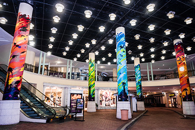 painted pillars at Sunset Place's entrance