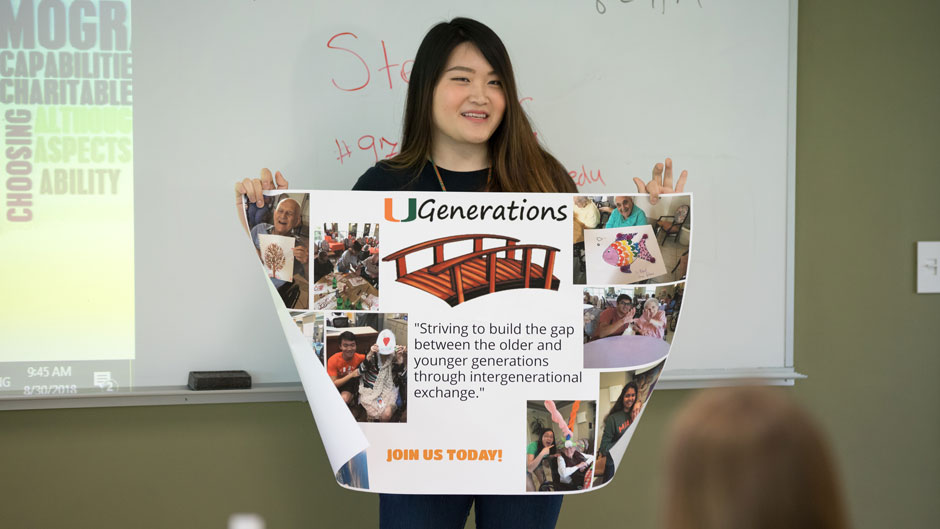 Freshman holding a poster