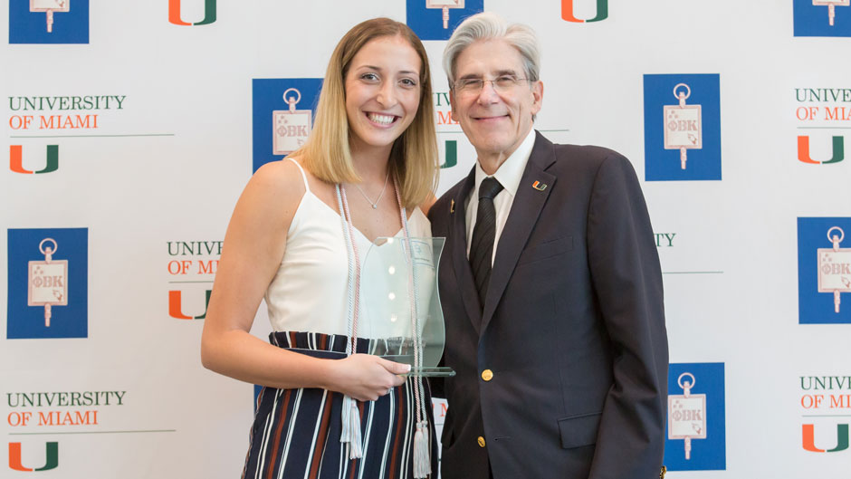 President Julio Frenk awarding senior Kendall Kilberger with the Phi Beta Kappa Award for Excellence in Liberal Learning at the Phi Betta Kappa initiation ceremony on Friday, April 12. 