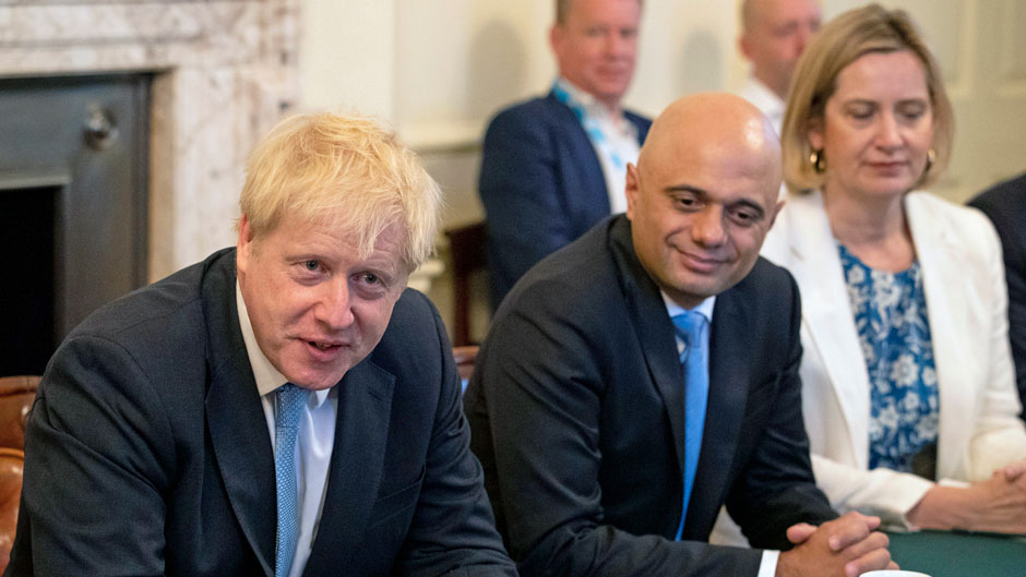 Britain's newly appointed Prime Minister Boris Johnson, left, holds his first Cabinet meeting, with Chancellor of the Exchequer Sajid Javid and Secretary for Work and Pensions Amber Rudd, right, at Downing Street in London, Thursday July 25, 2019. Johnson held his first Cabinet meeting Thursday as prime minister, pledging to break the Brexit impasse that brought down predecessor Theresa May.(Aaron Chown/Pool via AP)