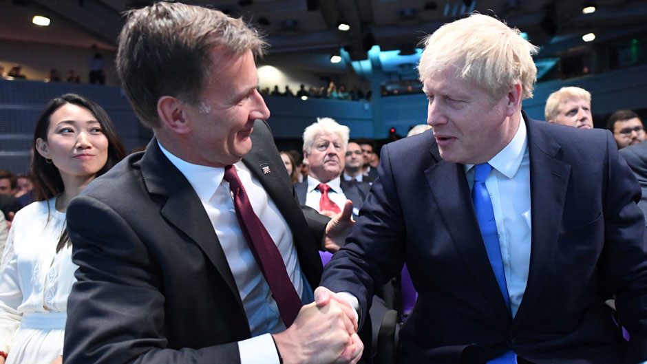 Jeremy Hunt, left, congratulates Boris Johnson after the announcement of the result in the ballot for the new Conservative party leader on Tuesday, July 23, 2019. Photo: Stefan Rousseau/Associated Press