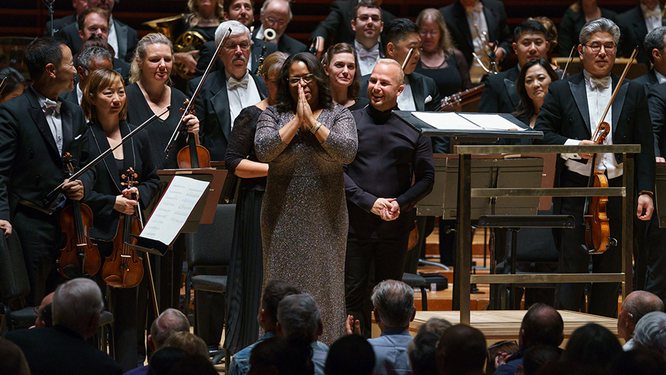 Frost School of Music flutist and composer Valerie Coleman receives an ovation after the Philadelphia Orchestra performed her orchestral version of "Umoja." 