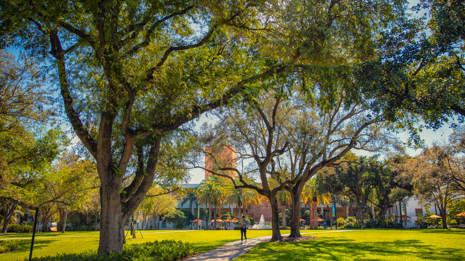 Student walks near the Merrick Building on Coral Gables campus