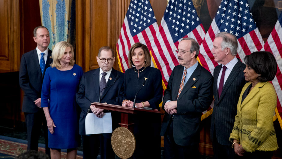 U.S. House Speaker Nancy Pelosi, D-Calif., center, is flanked by Democratic committee chairs during a news conference Wednesday following the vote to impeach President Donald J. Trump. Photo: Associated Press