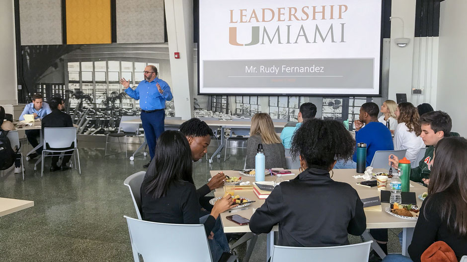 Rudy Fernandez, senior vice president for public affairs and communications and chief of staff to the president, addresses Leadership UMiami participants before they depart for Washington, D.C.