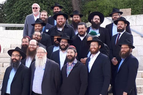 Fellig, last in the second row, with the red kippah