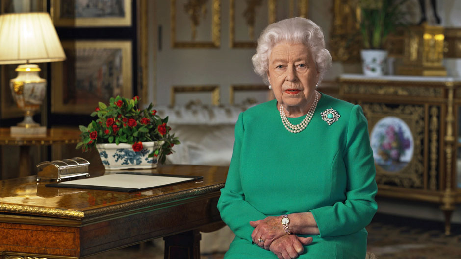 In this image taken from video and made available by Buckingham Palace, Britain's Queen Elizabeth II addresses the nation and the Commonwealth from Windsor Castle, Windsor, England, Sunday April 5, 2020. Queen Elizabeth II made a rare address, calling on Britons to rise to the challenge of the coronavirus pandemic, to exercise self-discipline in “an increasingly challenging time”. (Buckingham Palace via AP)