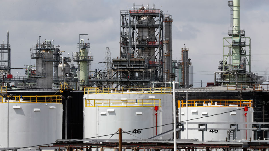 Storage tanks are shown at the Marathon Petroleum Corp. refinery in Detroit, Tuesday, April 21, 2020. The world is awash in oil, there's little demand for it and we're running out of places to put it. That in a nutshell explains this week's strange and unprecedented action in the market for crude oil futures contracts, where traders essentially offered to pay someone else to deal with the oil they were due to have delivered next month.(AP Photo/Paul Sancya)