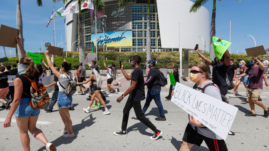 People protest the death of George Floyd in downtown Miami on Sunday, May 31. Photo: Associated Press