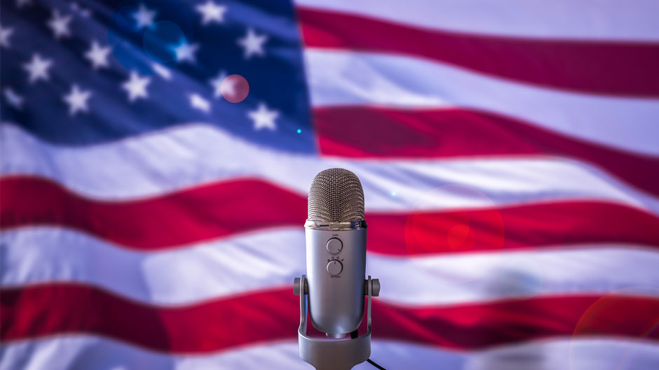 Image shows microphone In Front Of A USA Flag Ready For A Public Address