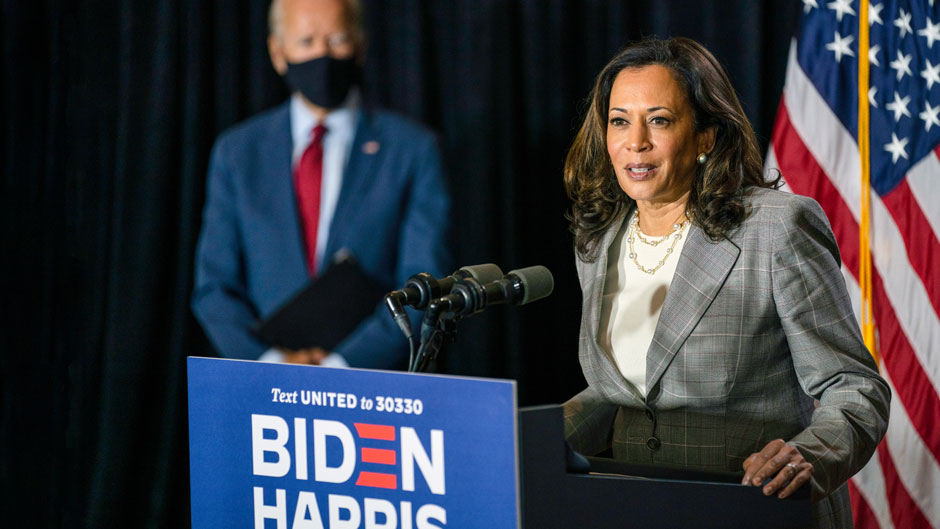 In this Aug. 13, 2020, file photo Democratic presidential candidate former Vice President Joe Biden stands left as his running mate Sen. Kamala Harris, D-Calif., speaks at the Hotel DuPont in Wilmington, Del. Photo: Associated Press