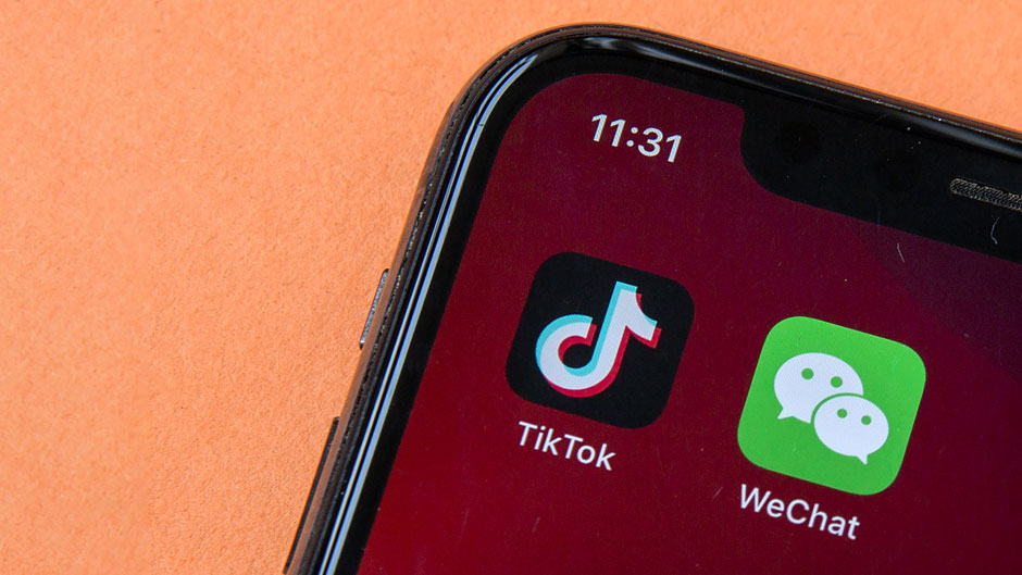 Icons for the smartphone apps TikTok and WeChat are seen on a smartphone screen in Beijing, Friday, Aug. 7, 2020. Photo: Associated Press
