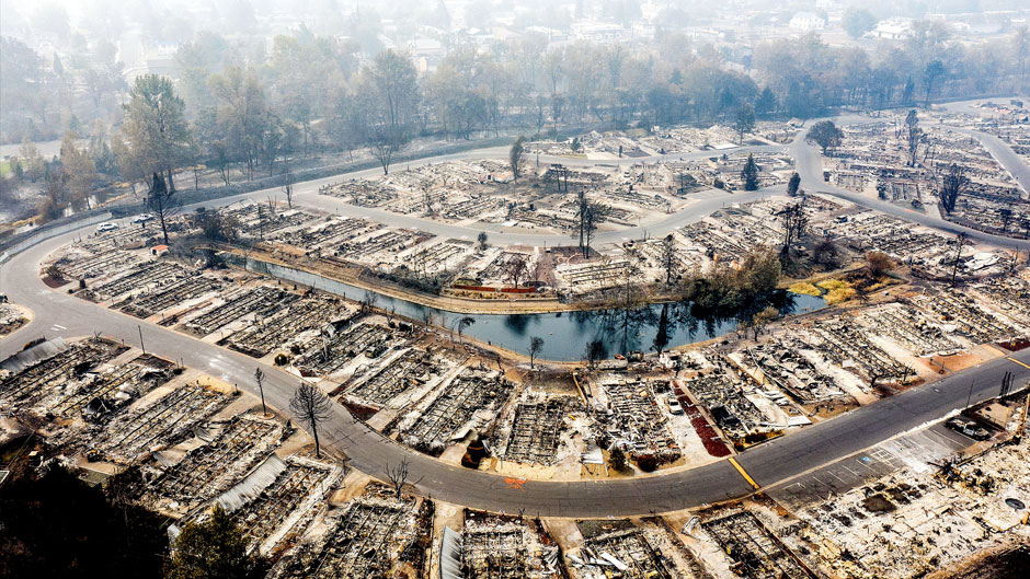 This aerial image taken with a drone shows homes leveled by the Almeda Fire line at Bear Lake Estates in Phoenix, Ore., on Tuesday, Sept. 15, 2020. (AP Photo/Noah Berger)