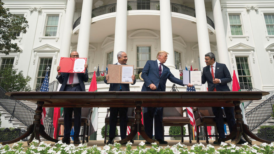 President Donald Trump, center, with from left, Bahrain Foreign Minister Khalid bin Ahmed Al Khalifa, Israeli Prime Minister Benjamin Netanyahu, and United Arab Emirates Foreign Minister Abdullah bin Zayed al-Nahyan, during the Abraham Accords signing ceremony on the South Lawn of the White House, Tuesday, Sept. 15, 2020, in Washington. (AP Photo/Alex Brandon)