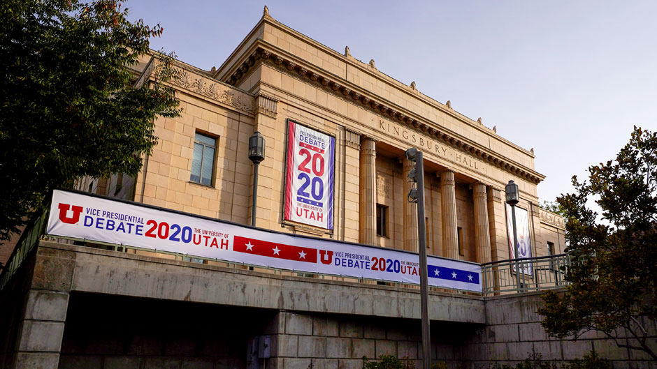 Banners hang from the outside of Kingsbury Hall ahead of the vice presidential debate between Republican Vice President Mike Pence and Democratic nominee Kamala Harris, Friday, Oct. 2, 2020, at the University of Utah in Salt Lake City. (AP Photo/Julio Cortez)