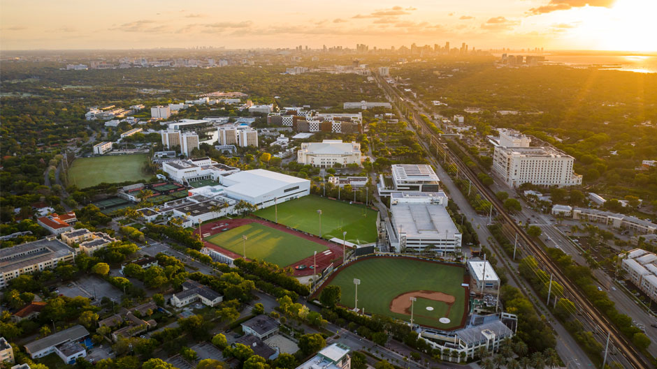 An aerial view of the Coral Gables Campus with the Downtown Miami skyline in the background. Photo: TJ Lievonen/University of Miami