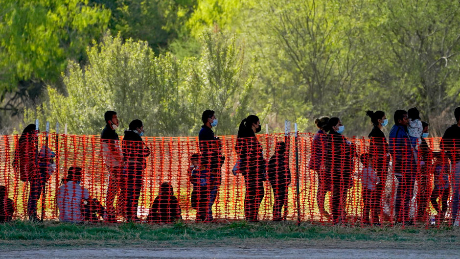 In this Friday, March 19, 2021, photo migrants are seen in custody at a U.S. Customs and Border Protection processing area under the Anzalduas International Bridge in Mission, Texas. The Biden administration is facing growing questions about why it wasn't more prepared for an influx of migrants at the southern border. The administration is scrambling to build up capacity to care for 14,000 young undocumented migrants now in federal custody — and more likely on the way. (AP Photo/Julio Cortez, File)