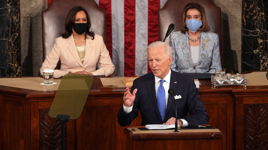 President Joe Biden speaks to a joint session of Congress Wednesday, April 28, 2021, in the House Chamber at the U.S. Capitol in Washington, as Vice President Kamala Harris and House Speaker Nancy Pelosi of Calif., watch. (Doug Mills/The New York Times via AP, Pool)