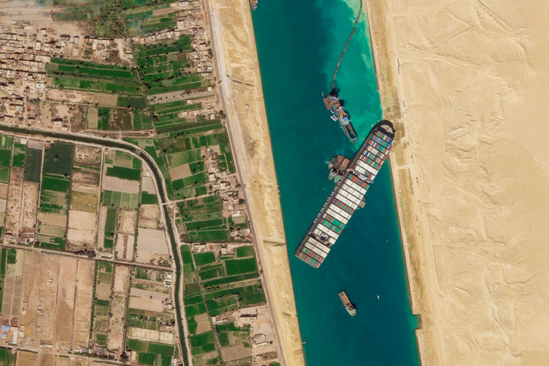 FILE - In this March 28, 2021, satellite file image from Planet Labs Inc, the cargo ship MV Ever Given sits stuck in the Suez Canal near Suez, Egypt. Consumers may face shortages and higher prices for electronics, toys, furniture and other goods should attempts to free the mammoth container ship stuck in Egypt’s Suez Canal drag on several weeks. (Planet Labs Inc. via AP)
