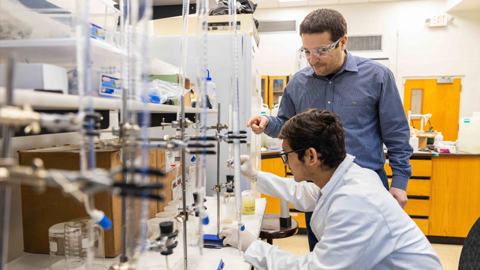 Ali Ghahremaninezhad works with a graduate student in the College of Engineering. Photo from 2019.