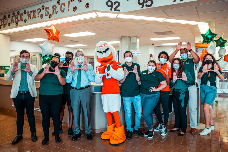 Julio Frenk mingles with Housing staff