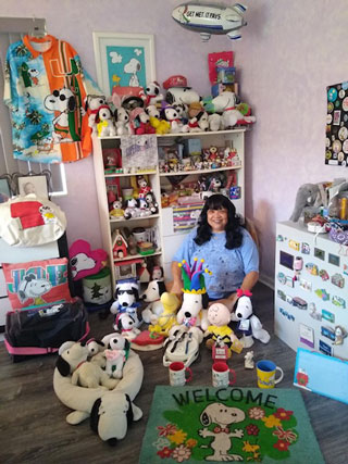 Carol Reynolds-Srot with some of her Snoopy collection