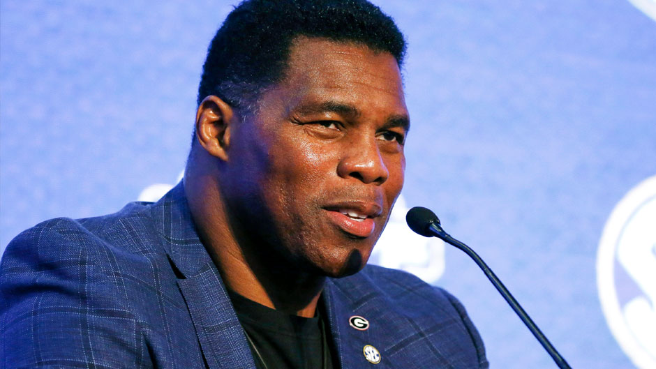 In this July 16, 2019, file photo, Herschel Walker talks about 150 years of college football during the NCAA college football Southeastern Conference Media Day in Hoover, Ala. Walker appears to have a coveted political profile for a potential Senate candidate in Georgia. (AP Photo/Butch Dill, File)