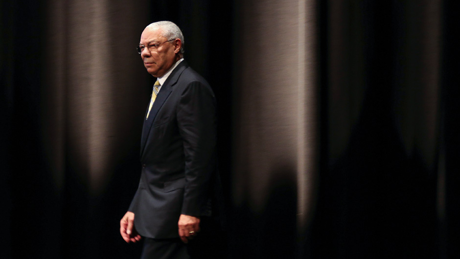 Former U.S. Secretary of State Colin Powell walks in the stage to speak during a seminar in Tokyo, Wednesday, June 18, 2014. (AP Photo/Eugene Hoshiko)