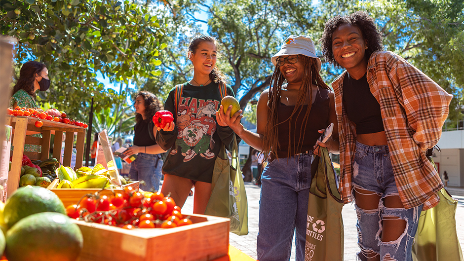 Kate Lui, a sophomore studying nursing; Cassandra Swilley, a sophomore studying interactive media and gender and sexuality studies; and Mecca McCain, a sophomore psychology and criminology major, gathered at the annual Fair Food Fair. Photo: Jenny Hudak/University of Miami
