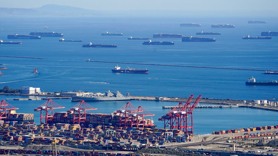 Cargo ships are seen lined up outside the Port of Los Angeles. (AP Photo/Mark J. Terrill)