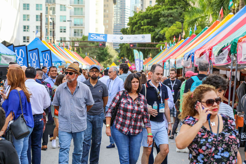 Visitors attend the 2019 Miami Book Fair street fair. Photo: Miami Dade College