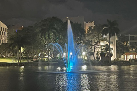 The Cobb Fountain on Lake Osceola lit in teal. Photo: John Tallon/University of Miami