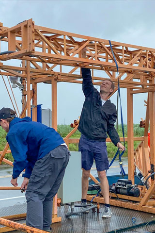 Rosenstiel School Ph.D. student Kurt Hansen deploys a hurricane-monitoring instrument in Louisiana ahead of Ida's arrival. Photo courtesy of Kurt Hansen 