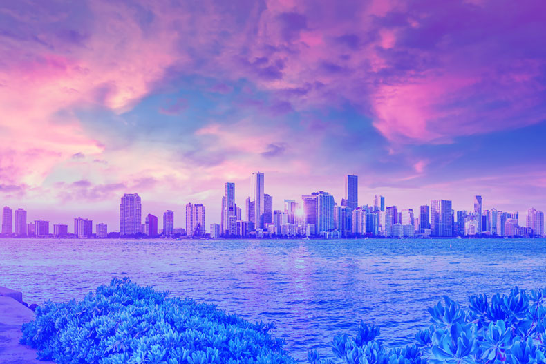 City of Miami skyline with pink and purple gradient overlay