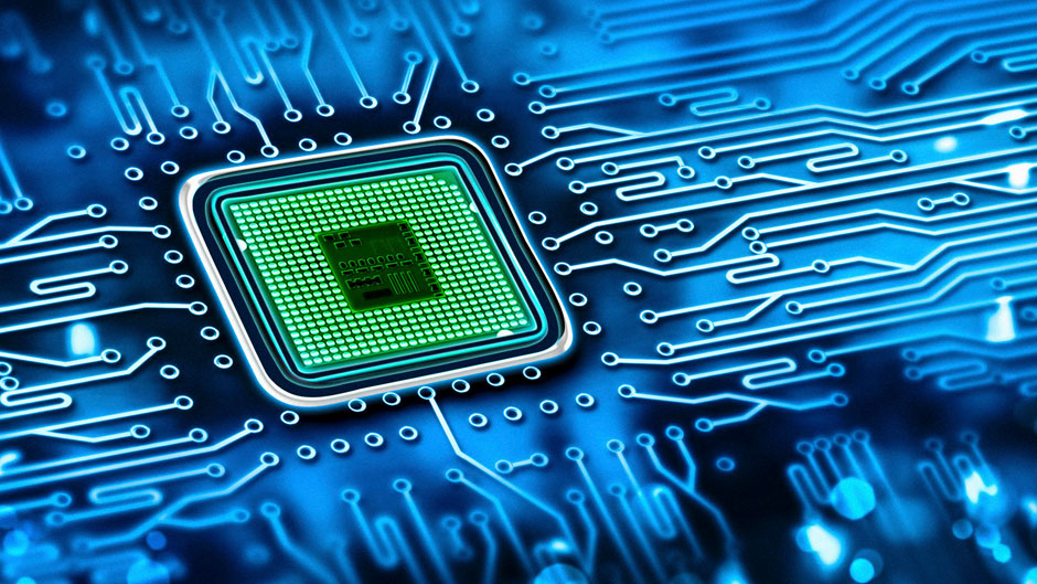 Green microchip set in a blue printed circuit board stock photo