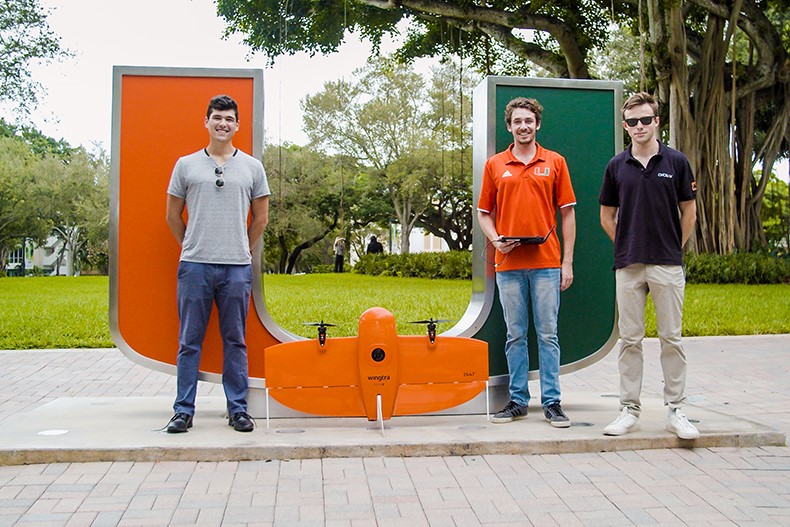 From left, Benjamin Kling, Alexander Leiva and Whitaker Redgate pose with Precision Ecology’s Wingtra drone. Photo: TJ Lievonen/University of Miami