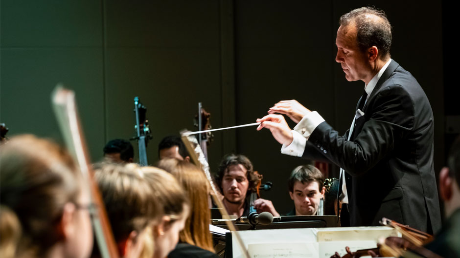 Conductor Scott Flavin, who will be conducting the concert on April 22, photographed with the Henri Mancini Institute Orchestra. Photo courtesy Frost School of Music