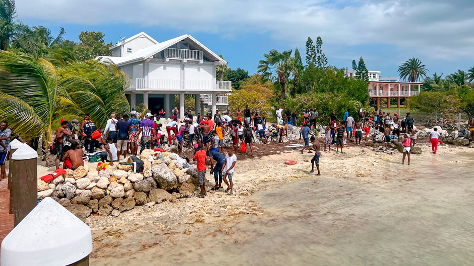 This photo provided by Monroe County Sheriff’s Office, Haitian migrants arrive on shore at Summerland Key, Fla., on Monday, March 14, 2022. Some 140 Haitian migrants came ashore there on Monday. Haitian migrants are reaching Florida's shores in a string of suspected smuggling operations that could outpace last year's migration waves.(Monroe County Sheriff’s Office via AP)