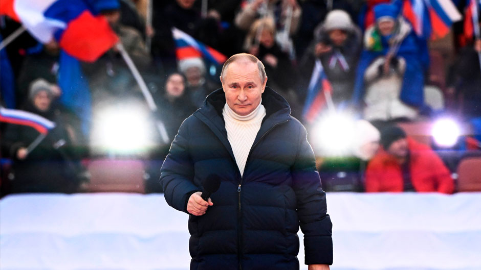 Russian President Vladimir Putin delivers his speech at a concert marking the eighth anniversary of the referendum on the state status of Crimea and Sevastopol and its reunification with Russia, in Moscow, Russia, Friday, March 18, 2022. (Sergei Guneyev/Sputnik Pool Photo via AP)