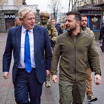 In this image provided by the Ukrainian Presidential Press Office, Ukrainian President Volodymyr Zelenskyy, center right, and Britain's Prime Minister Boris Johnson, center left, walk during their meeting in downtown Kyiv, Ukraine, Saturday, April 9, 2022. (Ukrainian Presidential Press Office via AP)
