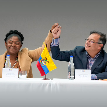 Colombian President-elect Gustavo Petro, right, and running mate Francia Marquez, join hands during a ceremony that certifies their election victory, in Bogota, Colombia, Thursday, June 23, 2022. (AP Photo/Fernando Vergara) 