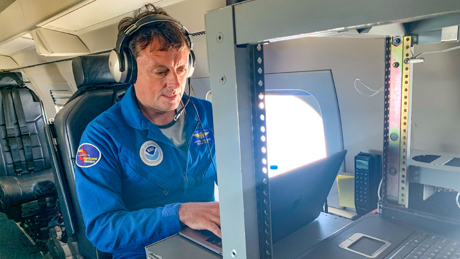 Jason Dunion monitors GPS dropsonde data during a Hurricane Hunter aircraft mission over Cape Verde.